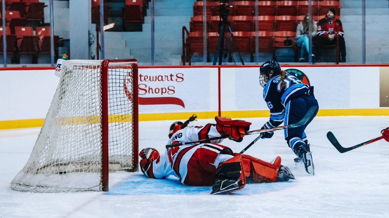 Kendall Sundby directs a backhand shot toward the Rensselaer goal.